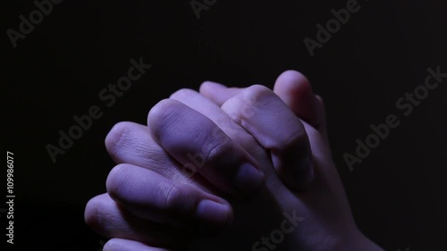 Teen girl is looking for an aid praying. Hands closeup. 4K UHD.