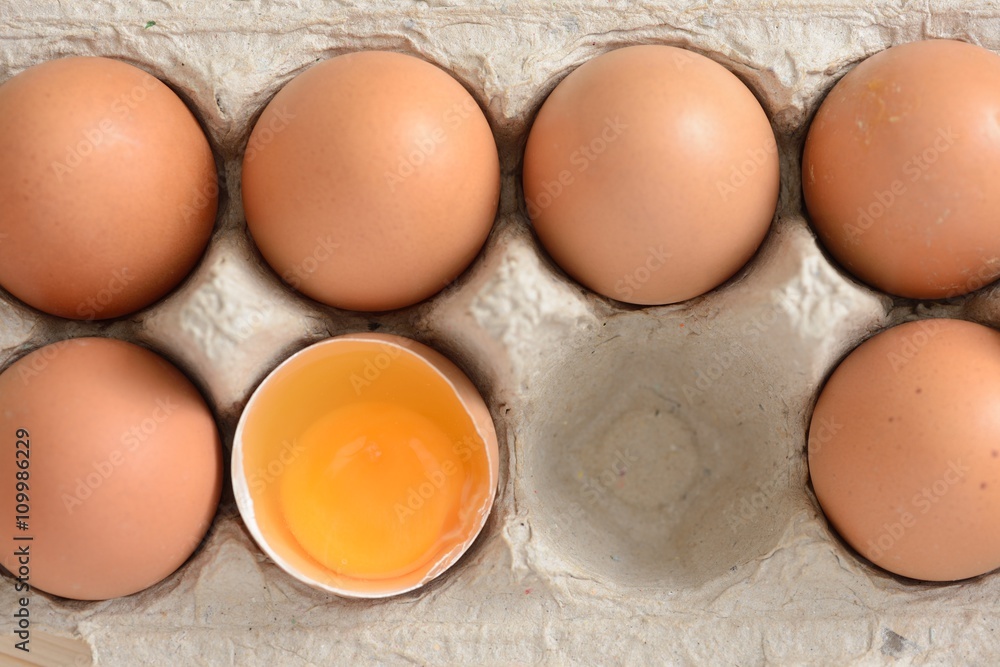 Overhead view of brown eggs in a carton Overhead view of brown eggs in a carton
