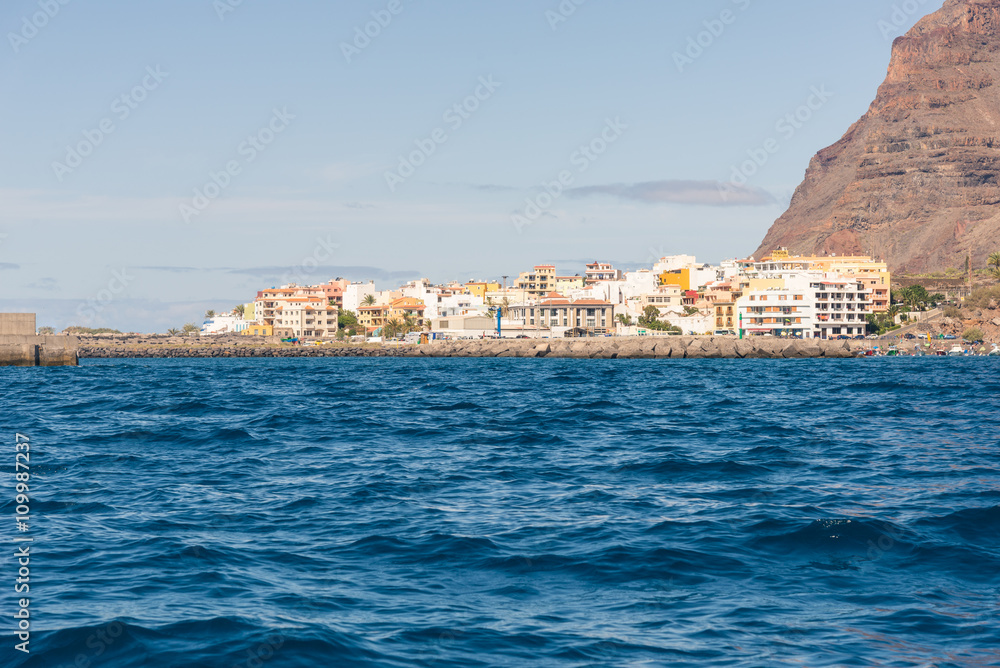 Incoming from sea, reaching the port of the Valle Gran Rey in the small town Vueltas on the Canary Islands offers a fantastic view to the mountains around the valley. Many boats in the harbor