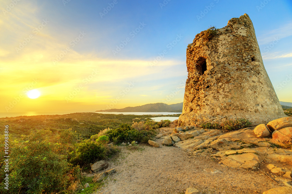 Susnet over old tower with a panoramic view of Villasimius, Sardinia
