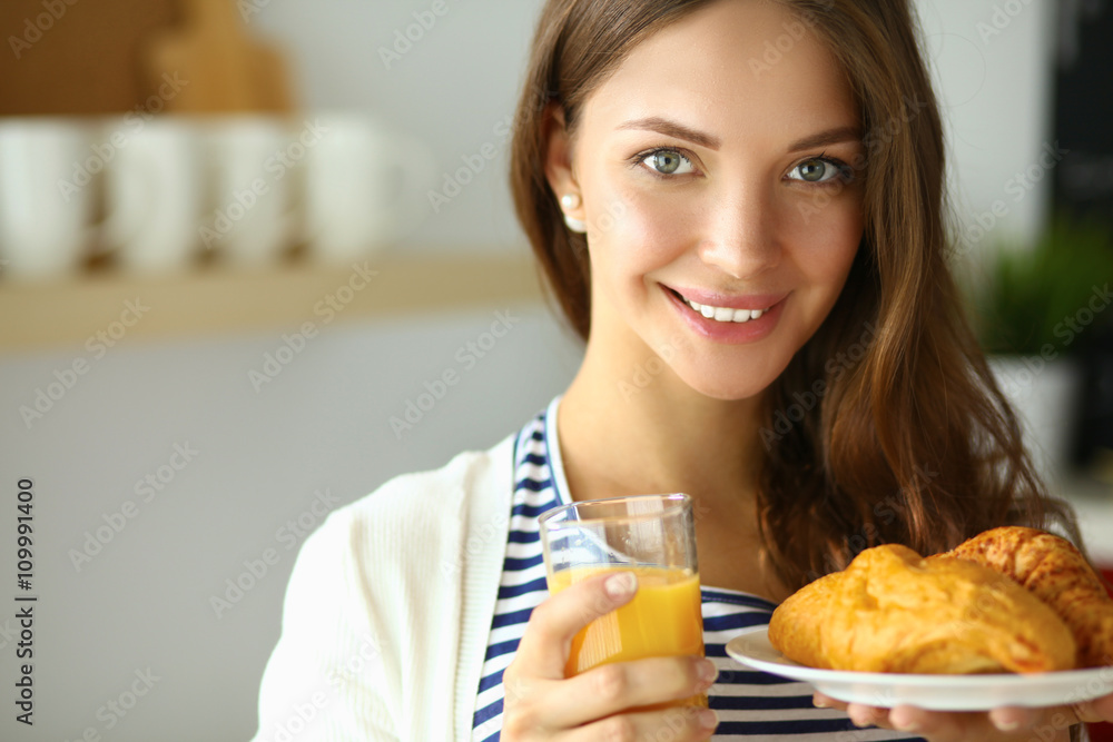 Portrait of a pretty woman holding glass with tasty juice Portrait of a pretty woman holding glass with tasty juice