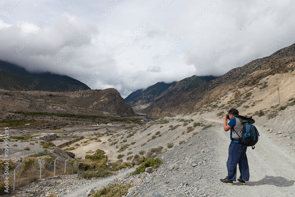Backpacker trekking in Annapurna circuit.