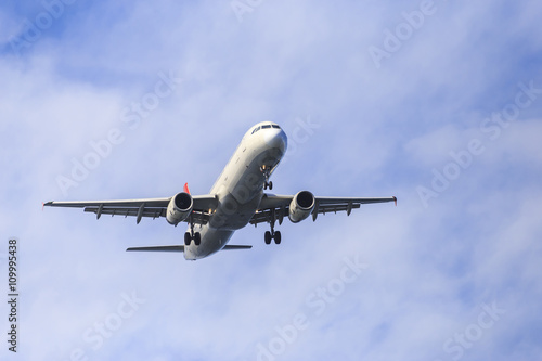 an airplane low pass during the morning with blue sky and elegant view