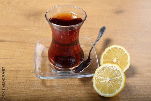 Turkish traditional tea in the incebelli glass with lemon  photo