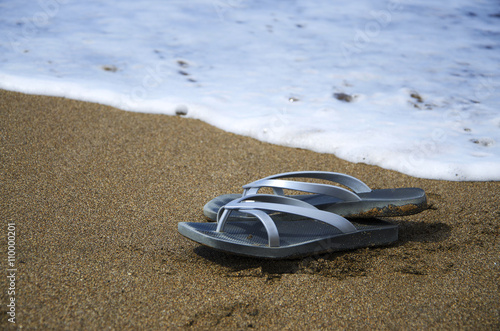 Flip flops on the sandy beach