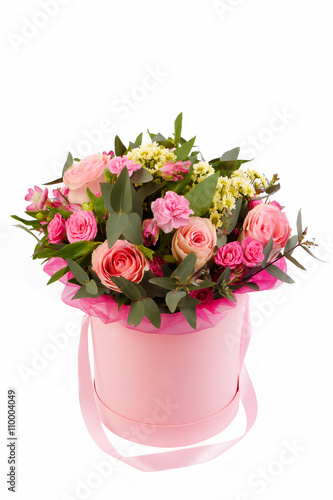 bouquet of beautiful colorful flowers on isolated background in the hat basket