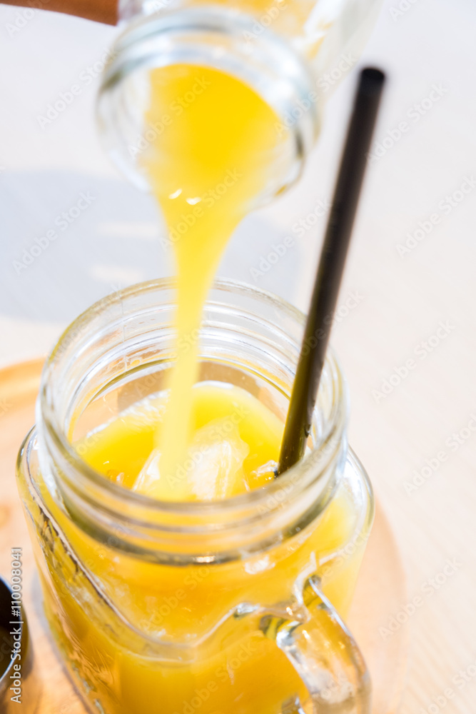 Poring passionfruit juice - motion blur Poring passionfruit juice - motion blur