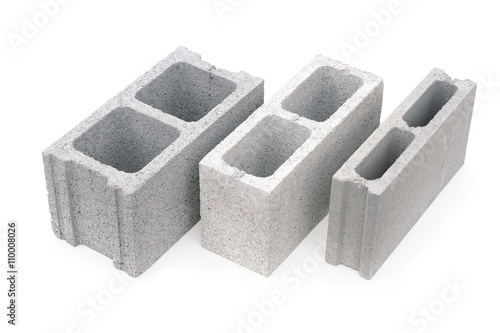 Gray concrete construction block isolated on white