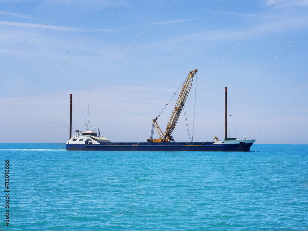 Crawler Crane on boat and ocean Crawler Crane on boat and ocean