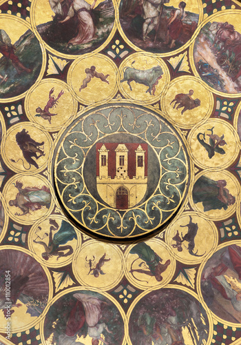 The calendar plate with coat of arms of Prague, Czech Republic. Wallpaper background