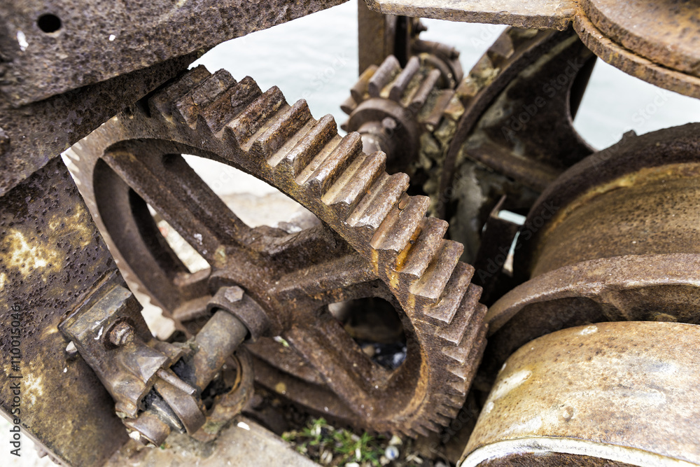 Old rusty gears for heavy industry as a machinery parts