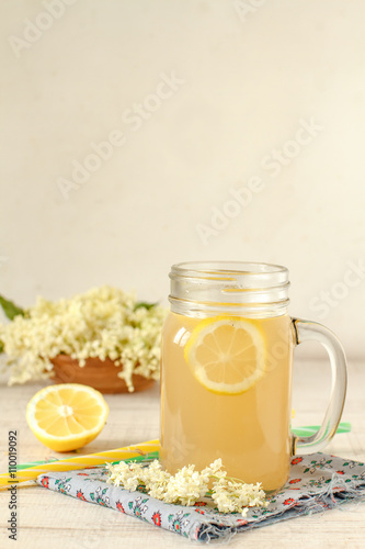 Elderberry flower drink with sliced lemon 