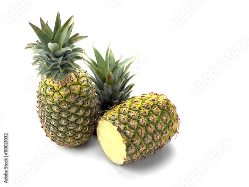 Two Pineapples on White showing one cut