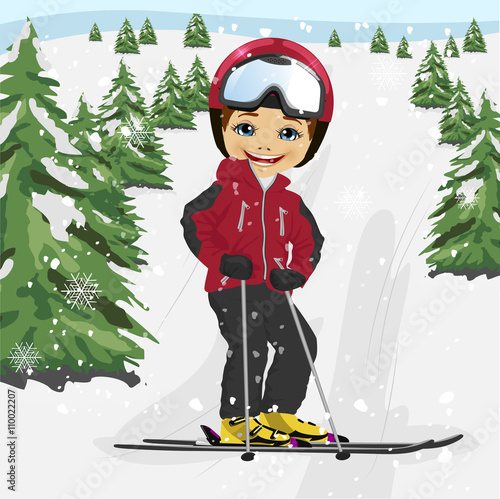 Little boy wearing red ski jacket and a helmet skiing in the ski resort 