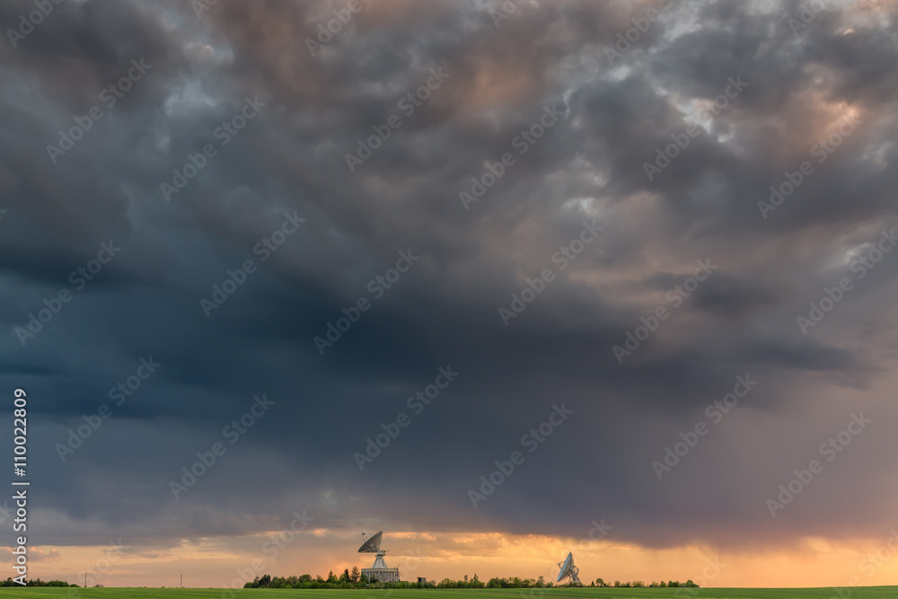 Fototapeta premium Observatory antennas and stormy clouds in HDR