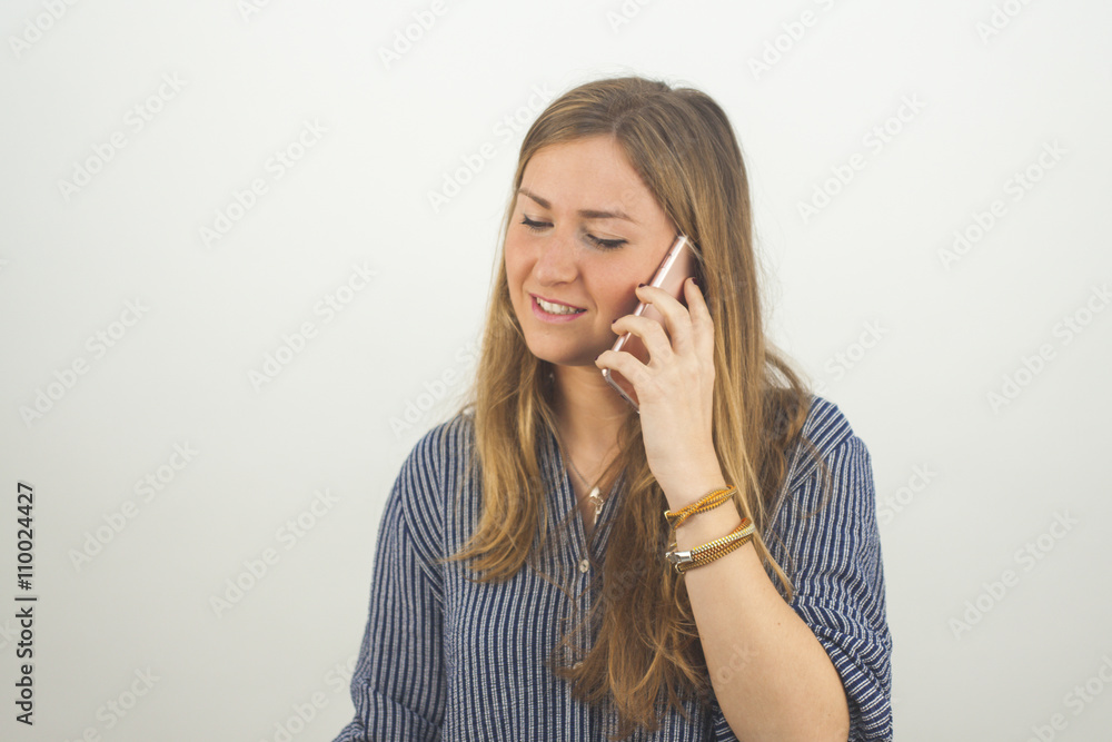 Medium shot portrait young blonde woman at the phone. Medium shot portrait young blonde woman at the phone.
