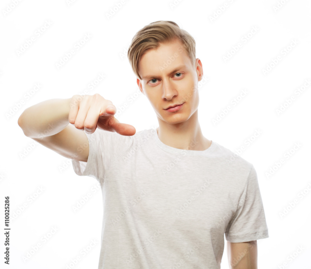 Young happy man with good idea sign in casuals looking at camera Young happy man with good idea sign in casuals looking at camera
