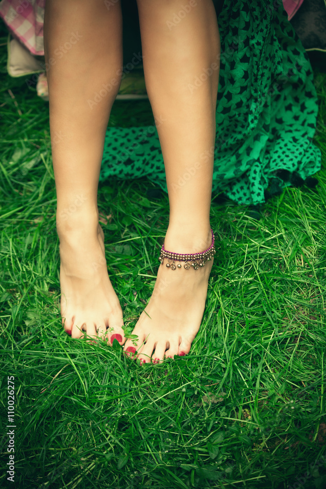 barefoot woman feet on grass