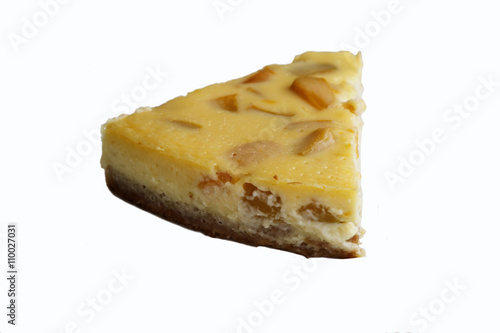 A Slice of Peach Cheesecake with a white background