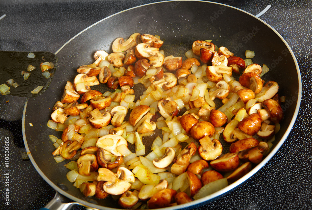 Fried mushrooms in a frying pan Fried mushrooms in a frying pan