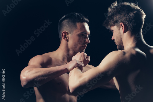 Young muscular men boxing © Volodymyr