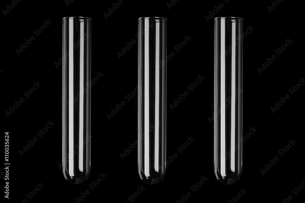 Three glass transparent test tubes on black background Three glass transparent test tubes on black background