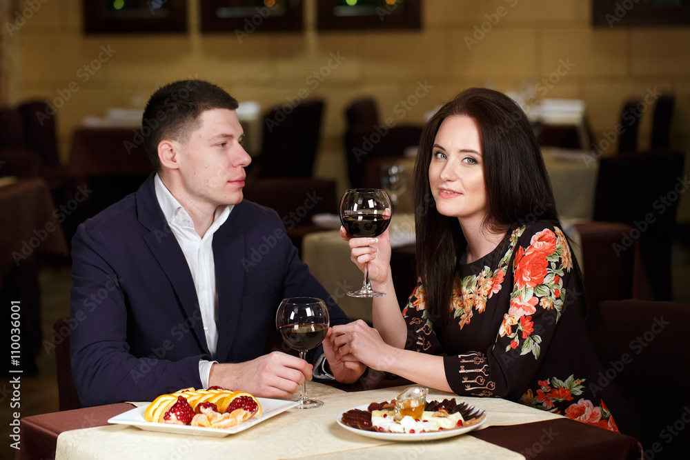 Couple toasting wineglasses in a luxury restaurant Couple toasting wineglasses in a luxury restaurant