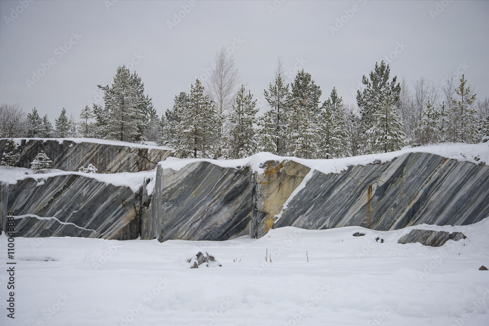 Marble cliff quarry in Ruskeala gloomy january afternoon. Karelia, Russia Marble cliff quarry in Ruskeala gloomy january afternoon. Karelia, Russia