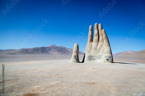 Las Manos, Chile - June 14th 2013 - The famous Las Manos monument in the middle of desert in northern Chile, near by Antofagasta city. photo