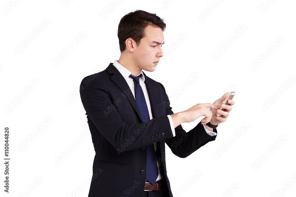 Young Caucasian business man frowning looking at mobile phone Young Caucasian business man frowning looking at mobile phone