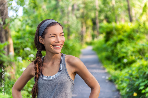 Obraz na płótnie Sports Asian girl smiling happy with her run exercise