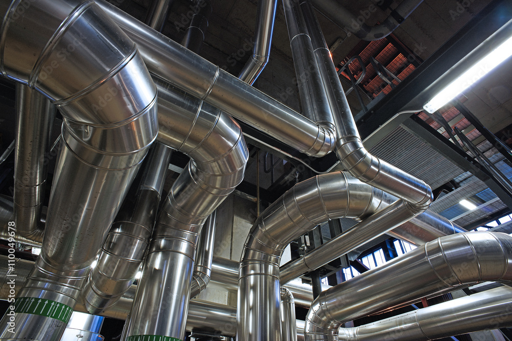 Fototapeta premium Equipment, cables and piping as found inside of a modern industr