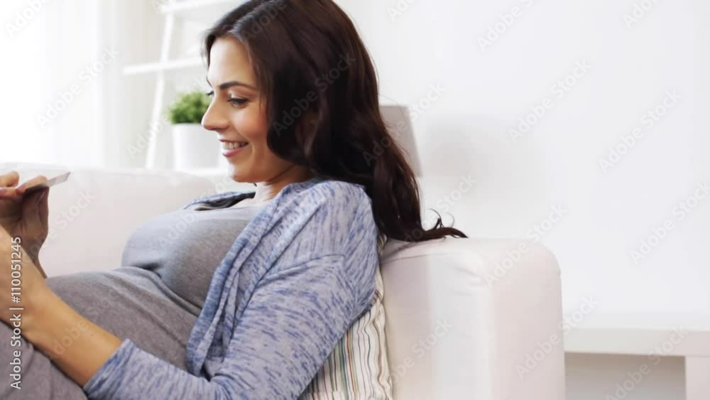 pregnant woman with tablet pc and credit card pregnant woman with tablet pc and credit card