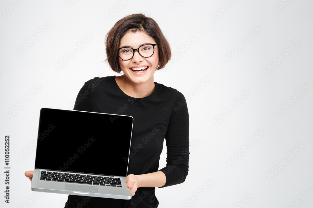 Woman showing blank laptop computer screen Woman showing blank laptop computer screen