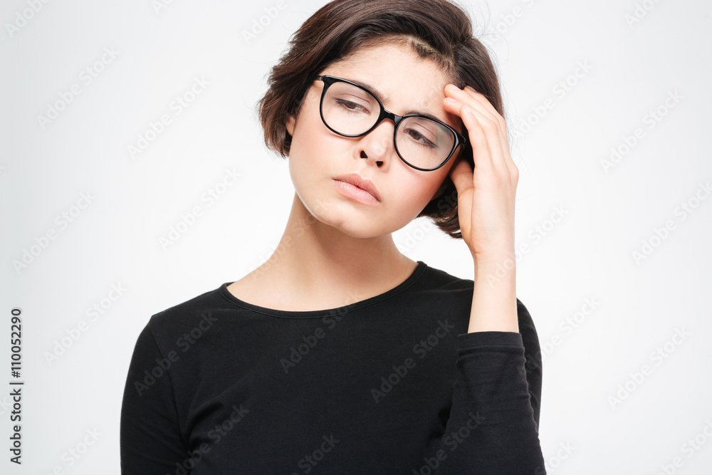 Woman standing with headache