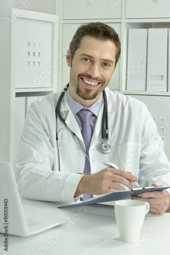 young doctor with laptop