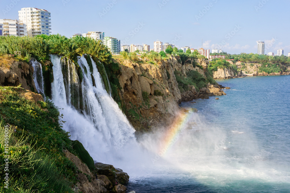 Waterfall Duden water falling into the Mideterranean sea with rainbow summer scene in Antalya, Turkey Waterfall Duden water falling into the Mideterranean sea with rainbow summer scene in Antalya, Turkey