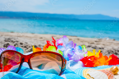 sunglasses and beach towel