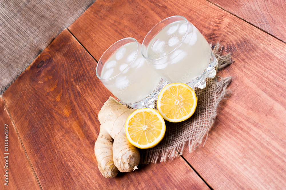 Ginger drink with ice and a lemon Ginger drink with ice and a lemon
