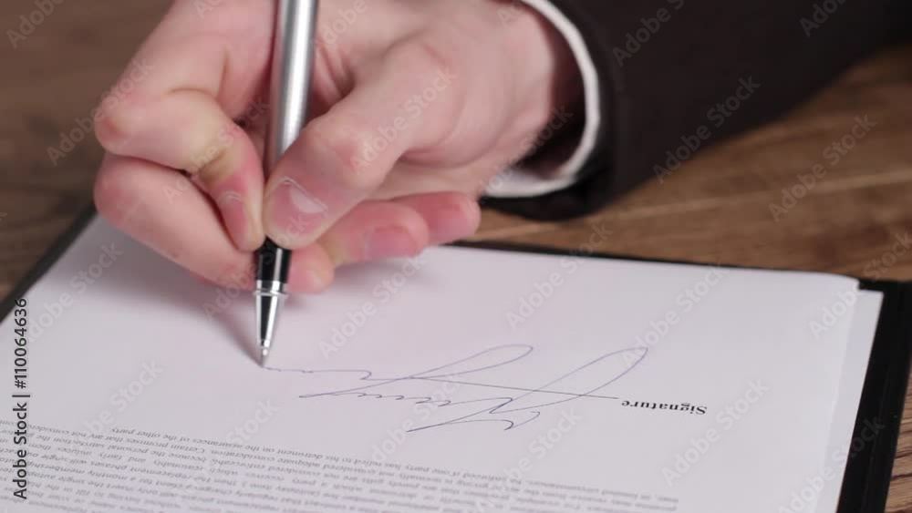 Male hand signing a document. Hand with pen signs paper. Another important decision. Step towards success. Male hand signing a document. Hand with pen signs paper. Another important decision. Step towards success.
