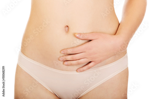Young woman belly with hand on it