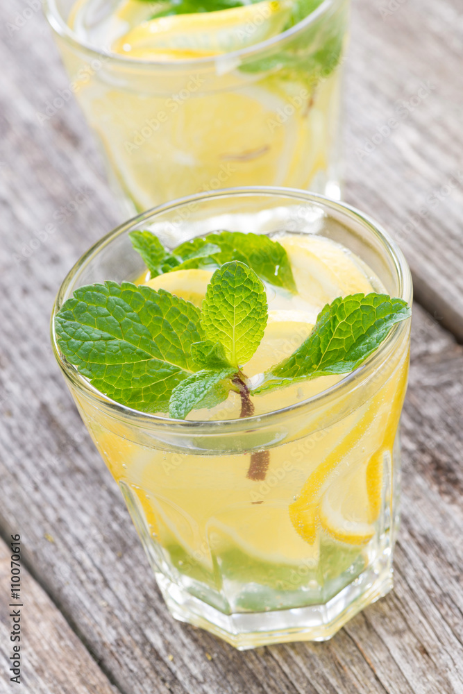 refreshing mint lemonade in glasses, close-up, vertical