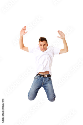 Young guy jumping from happiness