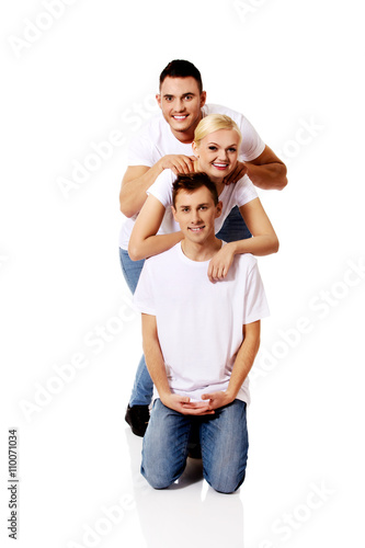 Happy friends together- one woman and two men