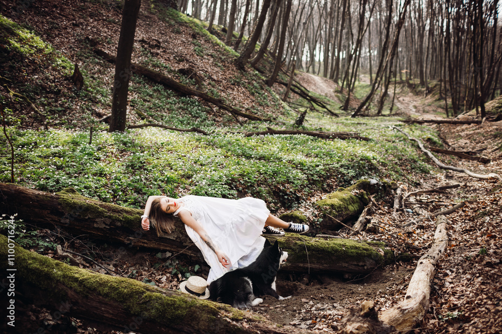 tender girl lying on a tree and resting after a walk tender girl lying on a tree and resting after a walk