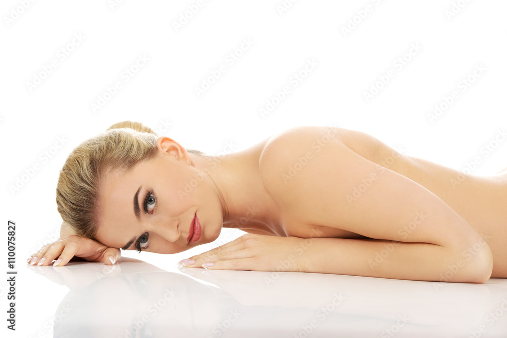 Beautiful naked woman lying on the floor. Beautiful naked woman lying on the floor.