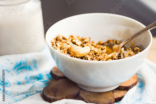 granola with cashews and banana with vegan milk, breakfast