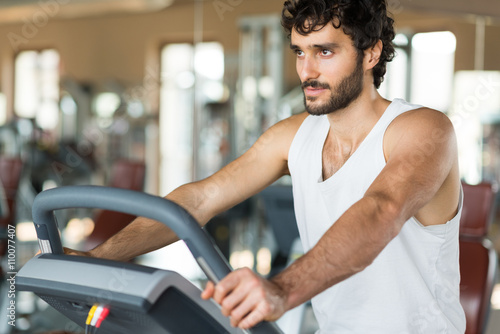 Man working out on a treadmill photo