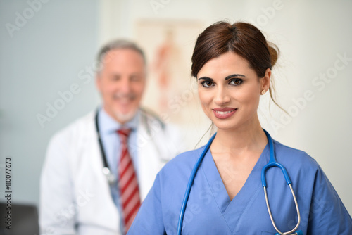 Smiling doctors in their office