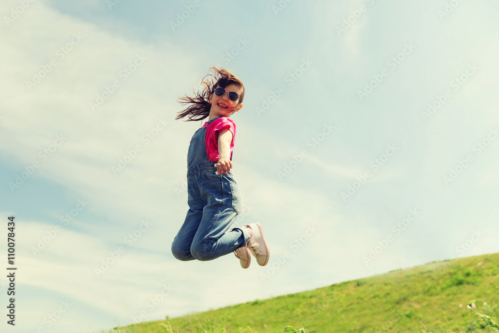 happy little girl jumping high outdoors happy little girl jumping high outdoors